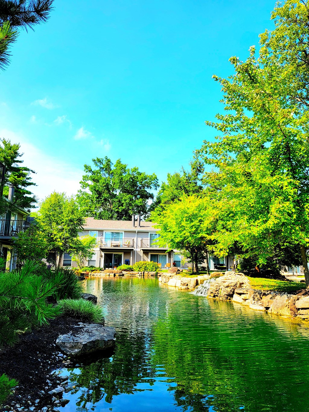 a pond in front of a building at Harpers Point Apartments, Cincinnati, Ohio