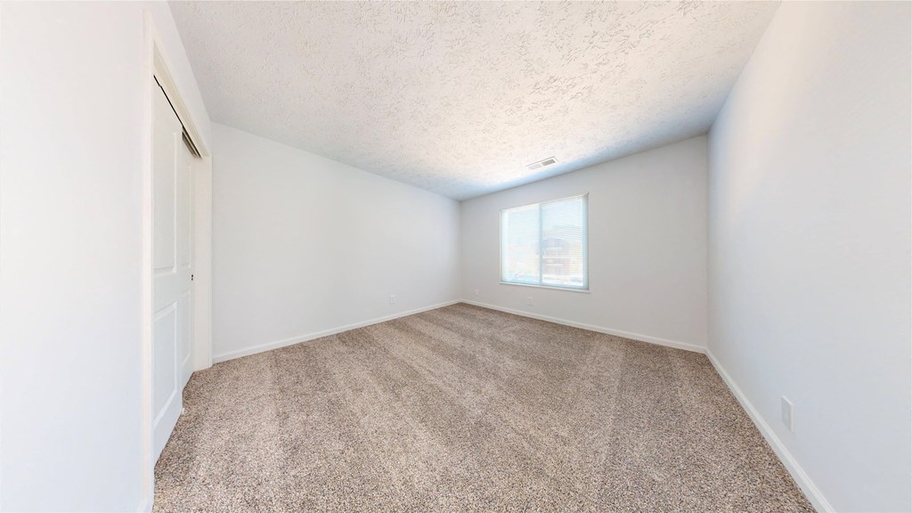 a bedroom with white walls and carpet at Lawrence Landing, Indianapolis, 46226