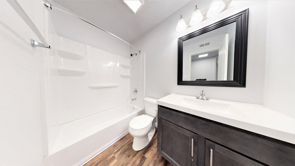 a bathroom with a toilet sink and bathtub at Lawrence Landing, Indiana, 46226