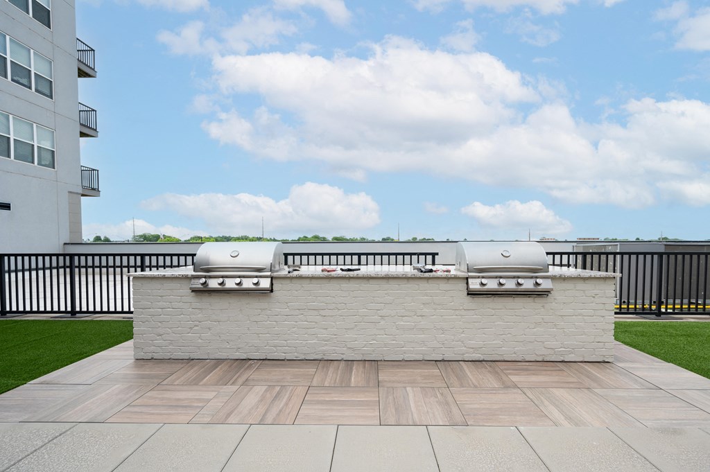 a barbecue grill on the roof of a building