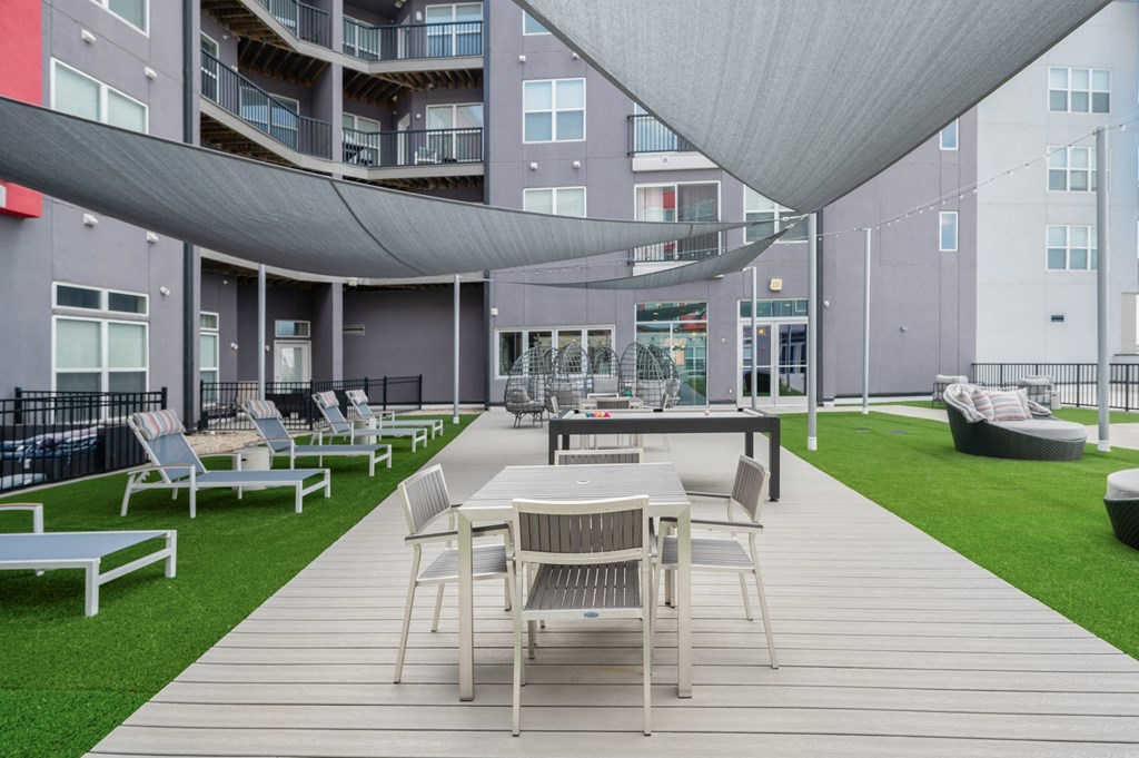 a rendering of a patio with tables and chairs