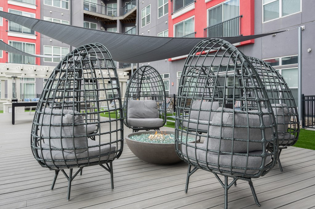 a set of three geodesic egg chairs on a patio