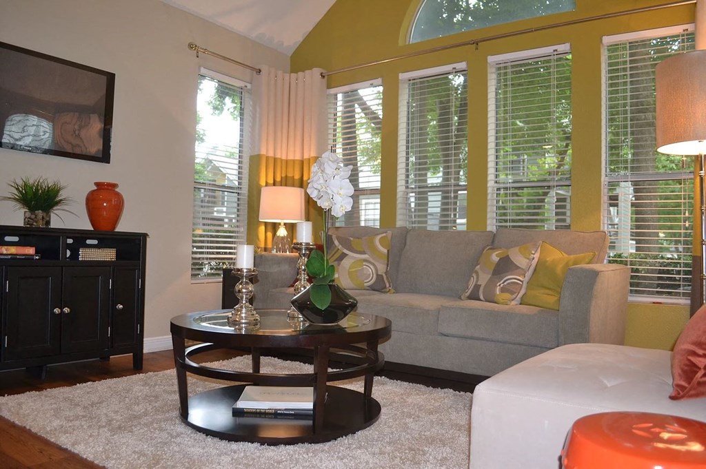 a living room with a couch and a table