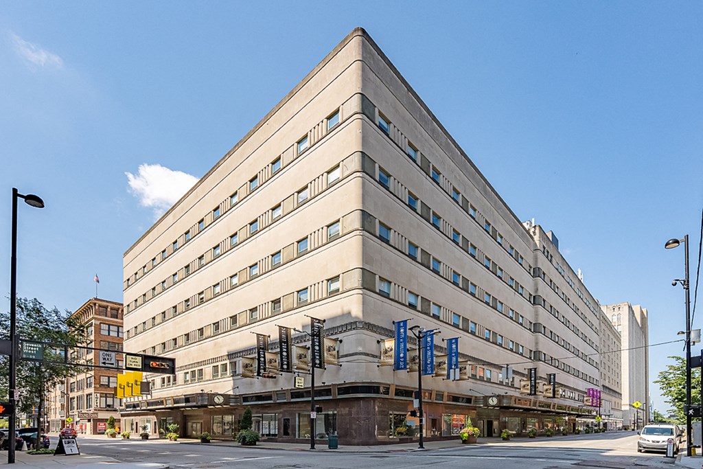 a large building on the corner of a city street