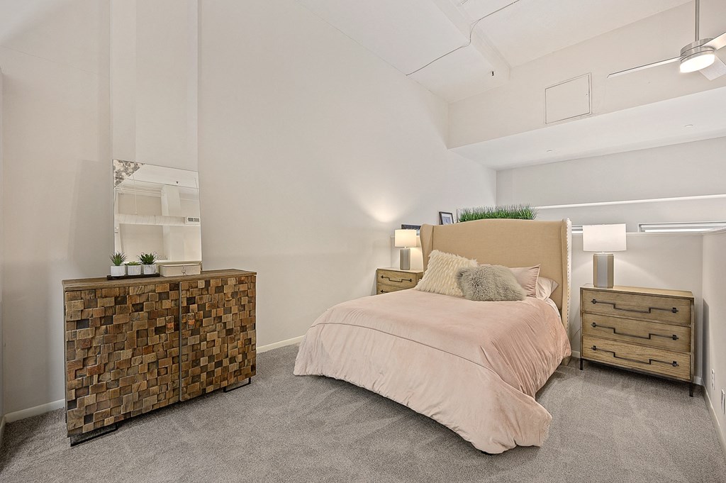 a bedroom with a bed and a dresser