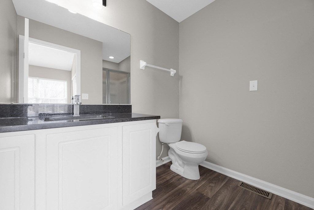 an empty bathroom with a toilet and a sink at Traditions at Slate Ridge, Reynoldsburg Ohio