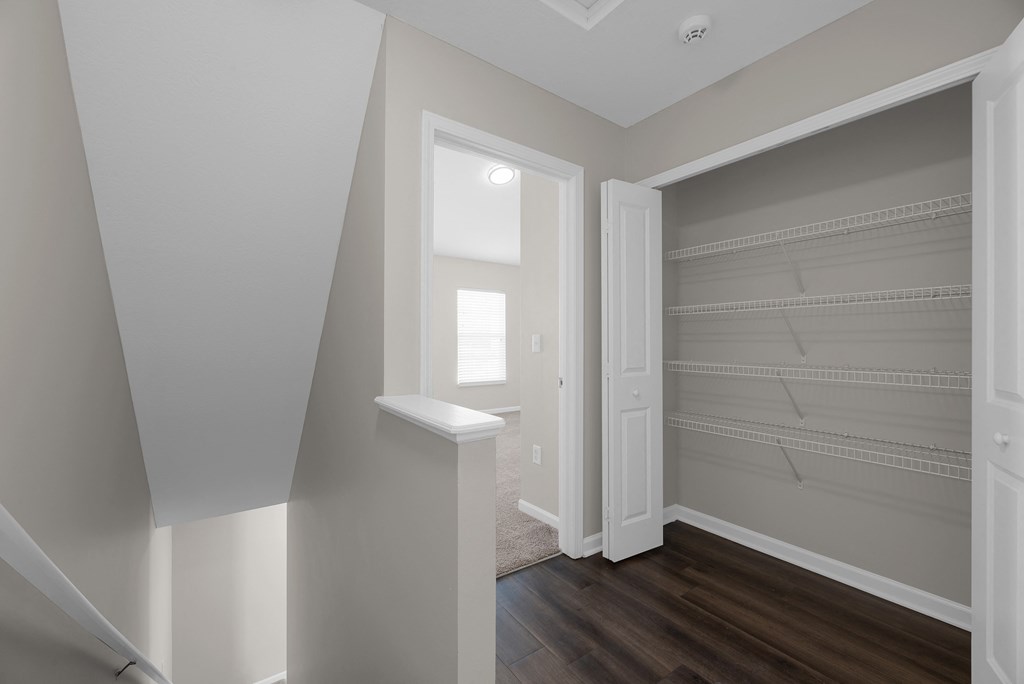 an empty room with a closet with shelves and a window at Traditions at Slate Ridge, Ohio