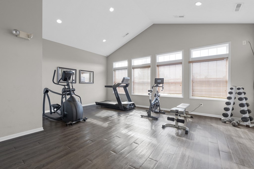 a home gym with exercise equipment and windows at Traditions at Slate Ridge, Ohio, 43068