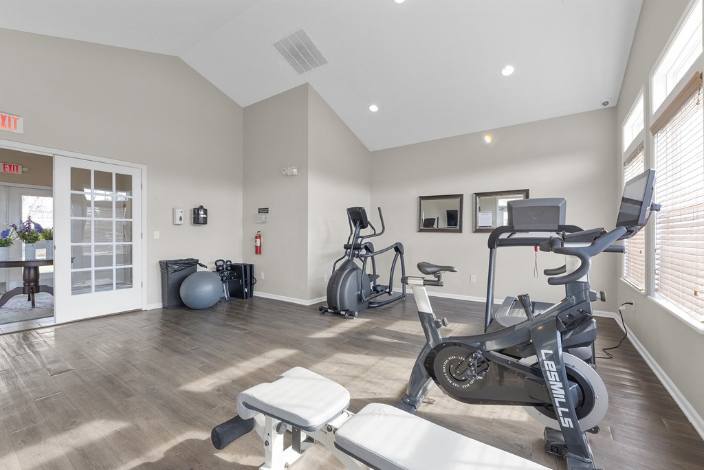 a gym with treadmills and exercise equipment at the preserve at polk apartments at Traditions at Slate Ridge, Ohio