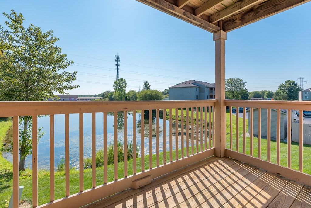 the view from the deck of a house overlooking the water