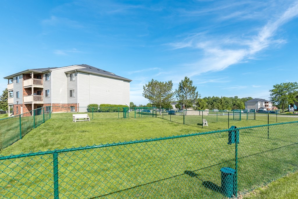 green lawn with green fence at mill pond dog park
