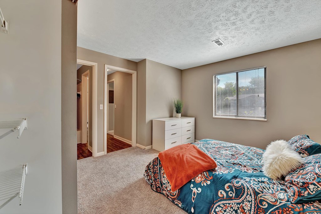 a bedroom with a bed and a closet