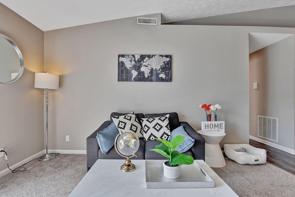 a living room with a couch and a table