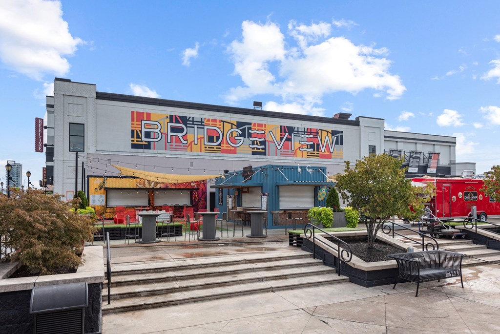 a large building with a sign on the side of it at Monmouth Row Apartments, Newport, KY