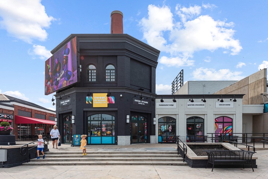 a large building with stairs in front of it at Monmouth Row Apartments, Newport, KY