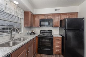 Kitchen with cabinets and Appliances at Normandy Club, Ohio