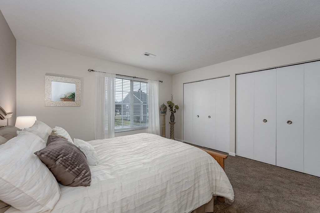 Bedroom with cozy bed and window at Normandy Club, Centerville, OH, 45459