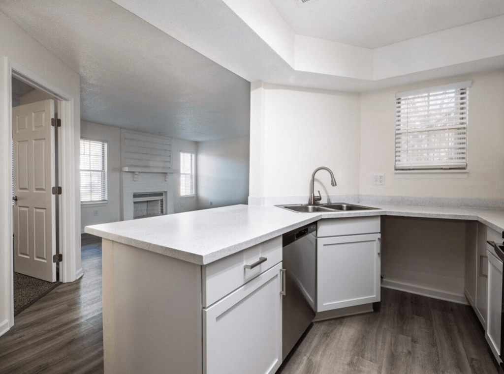 the kitchen of a new home with white cabinets and a white counter top at The Berryessa Apartments, Columbus, OH, 98104