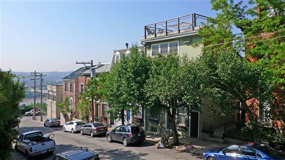 a city street with cars parked on the side of it