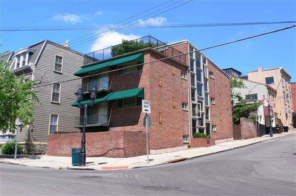 a brick building on the corner of a street