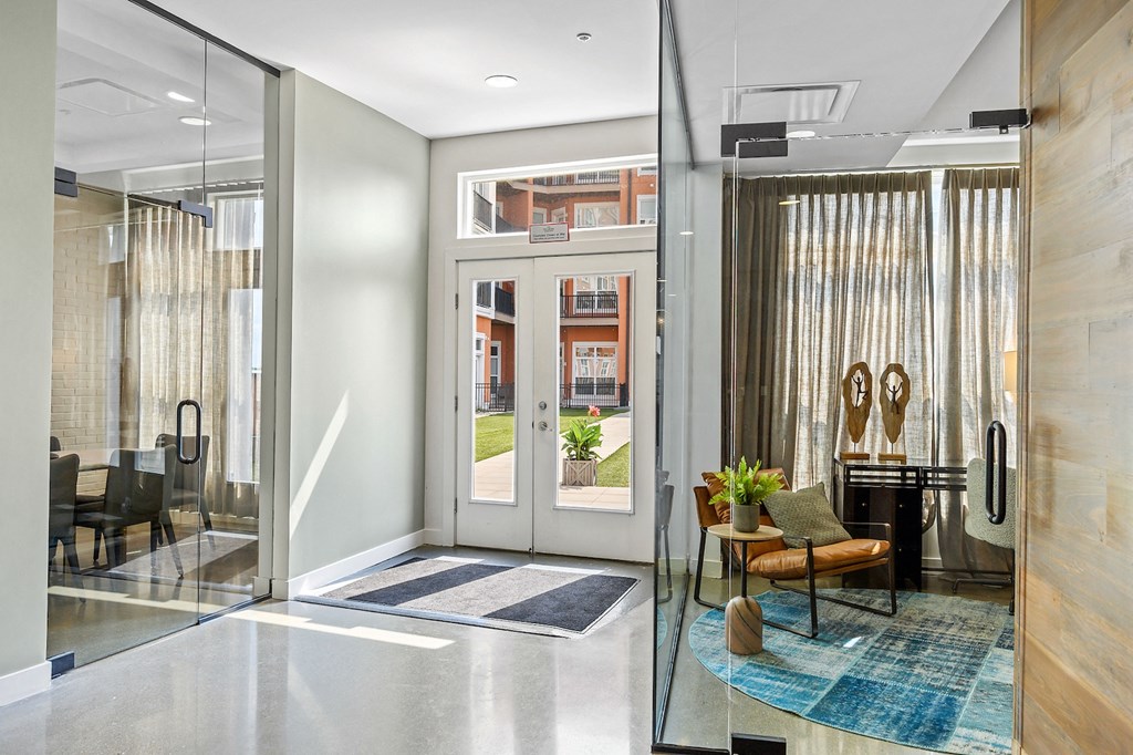 Three-Bedroom Apartments in West Chester, OH - Liberty Center - Lobby with Glass Doors, Waiting Area, and Window Drapes