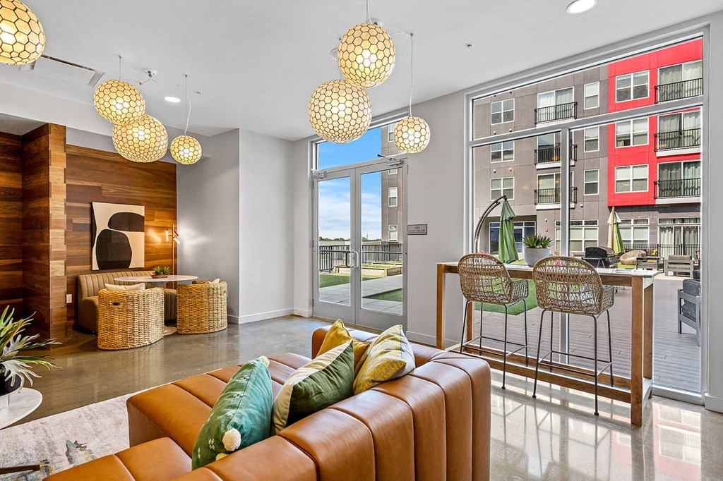 a living room with a couch and a table with chairs