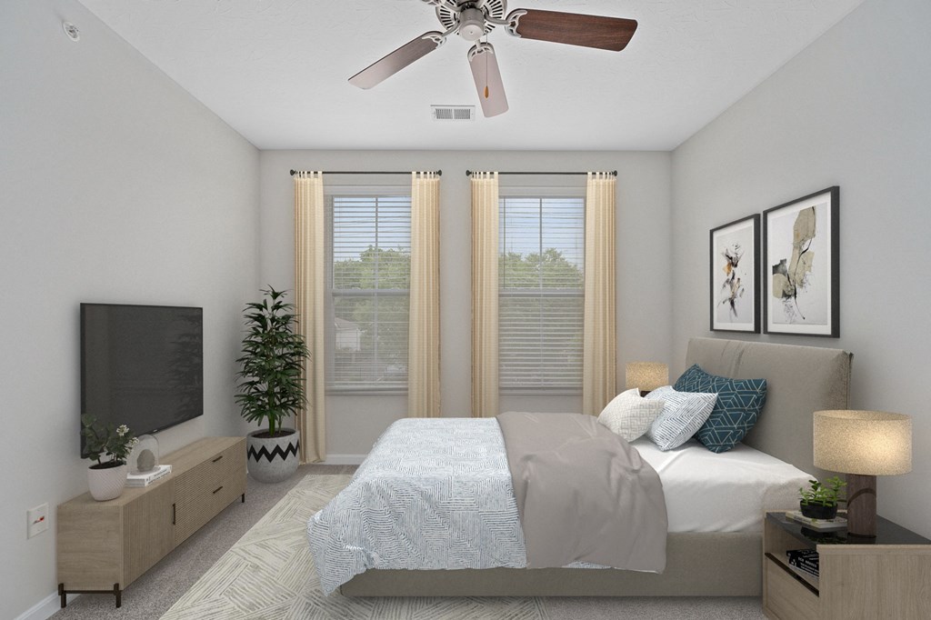 the preserve at ballantyne commons bedroom with bed and ceiling fan at Monmouth Row Apartments, Newport, KY