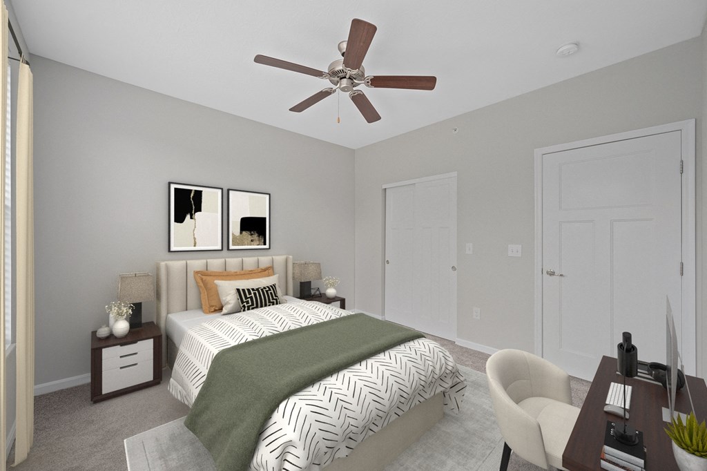 a bedroom with a large bed and a ceiling fan at Monmouth Row Apartments, Newport, KY