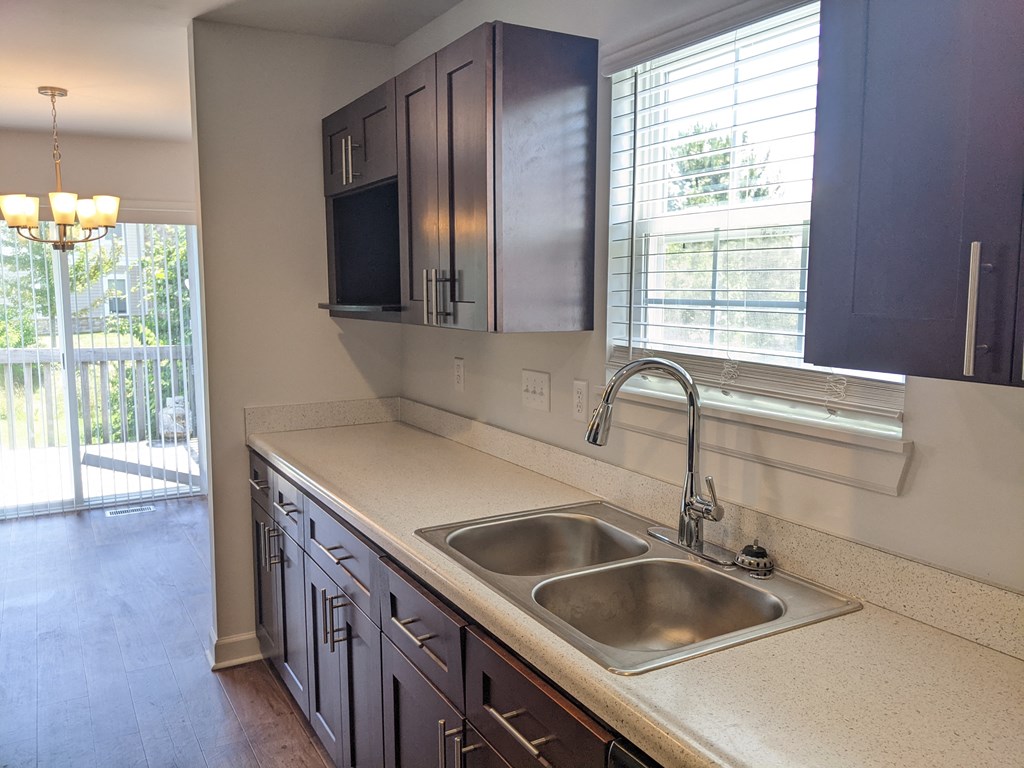 a  renovated kitchen with a sink and a window Richwood North Townhomes, Florence, KY