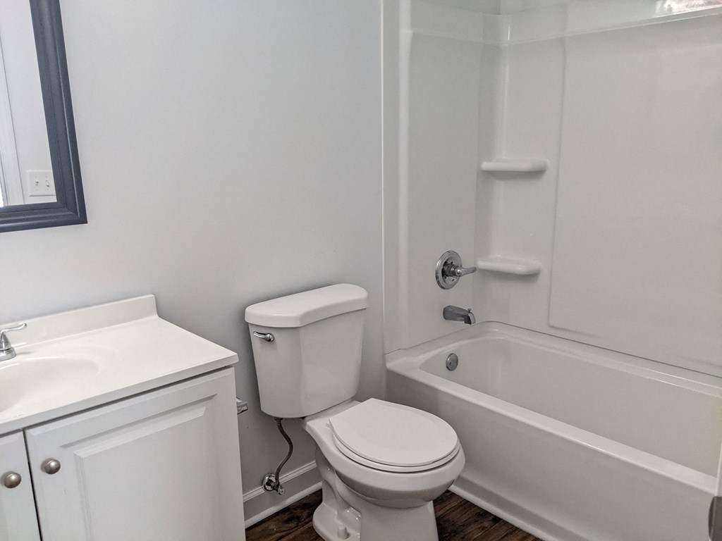 a bathroom with a toilet sink and bathtub