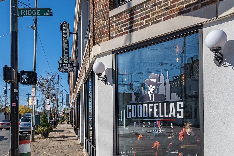 a window display of a man wearing a cowboy hat