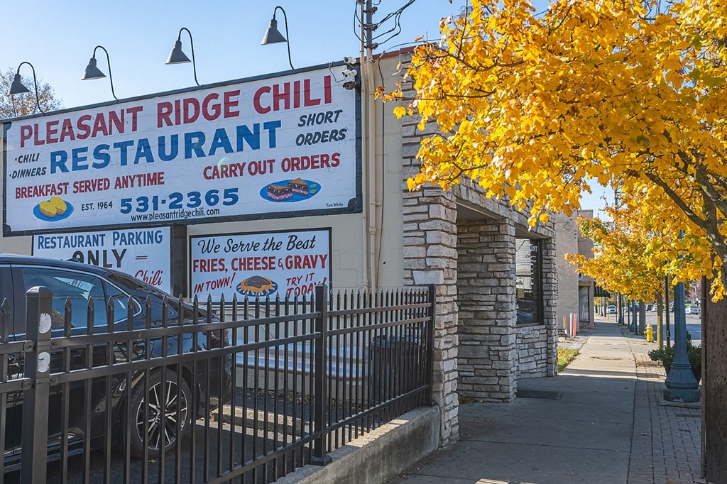a restaurant sign on the side of a building