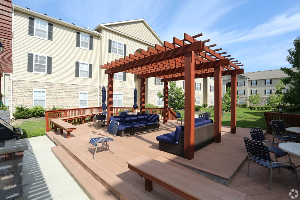 a backyard patio with a wooden deck and a pergola at Prescott Place, Ohio