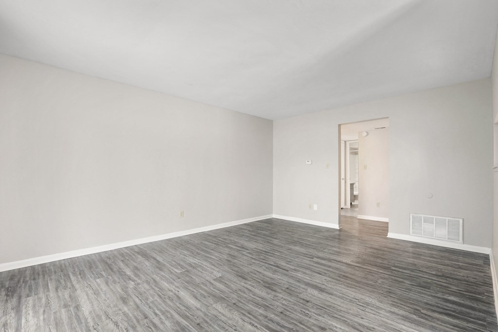 A room with a grey floor and white walls.