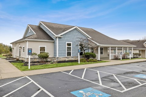 Clubhouse building with parking and handicap space at North Central Village Apartments, Columbus, 43211
