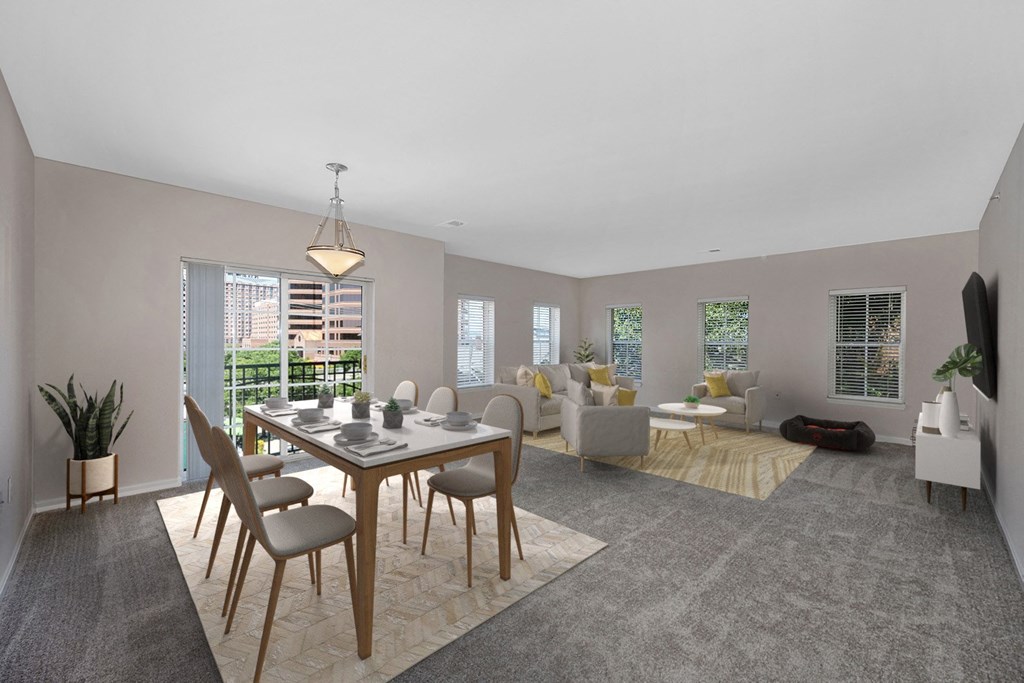 a living room and dining room with a table and chairs