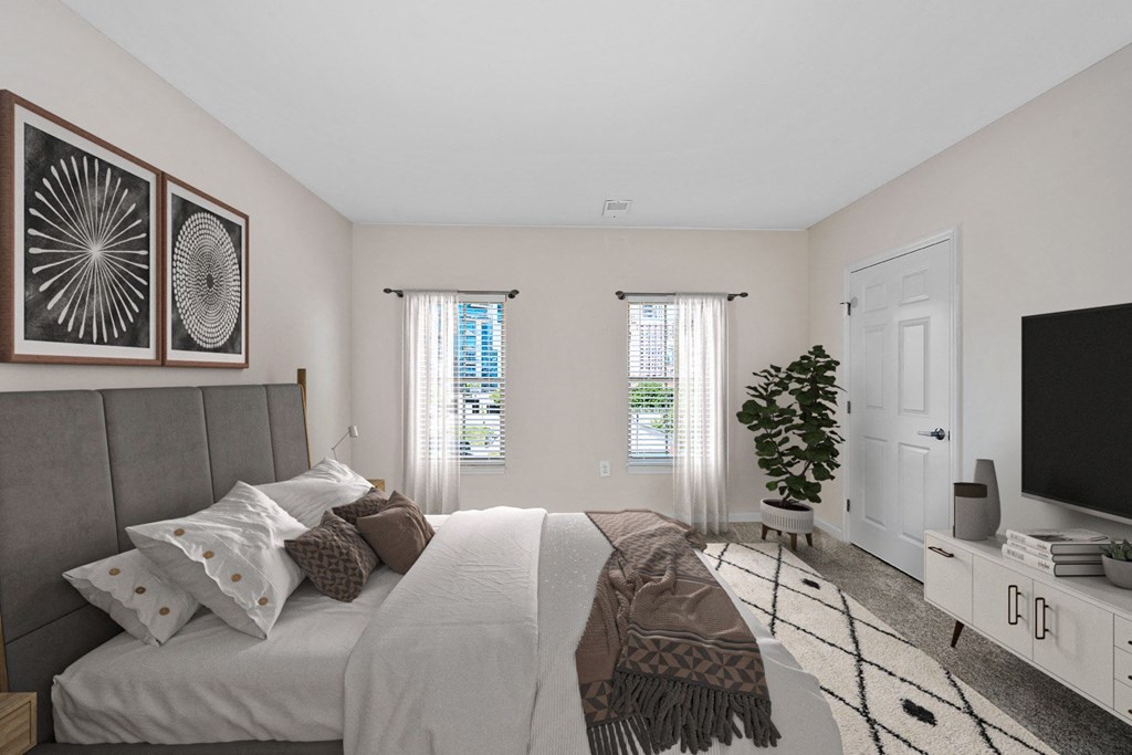 a bedroom with a bed and a tv