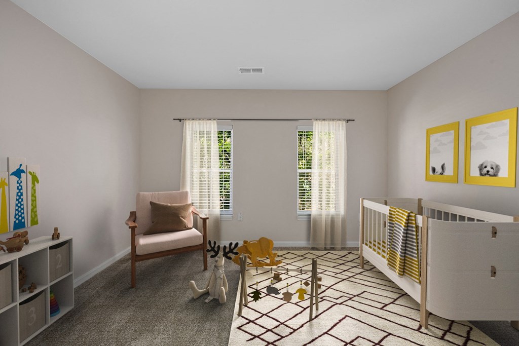 a nursery with a crib and a chair and a rug