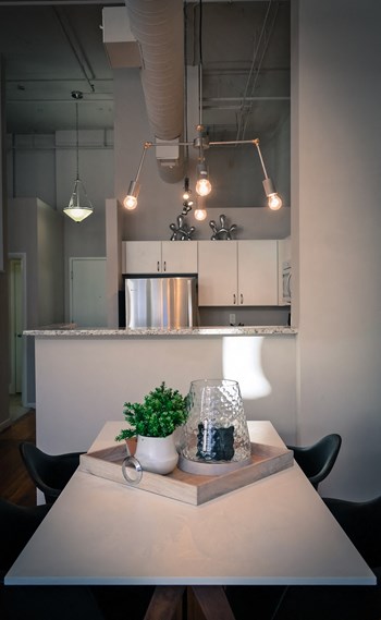 Dining Room and Kitchen View Dining Room and Kitchen View at The Lofts at Shillito Place, Cincinnati, Ohio - Photo Gallery 4