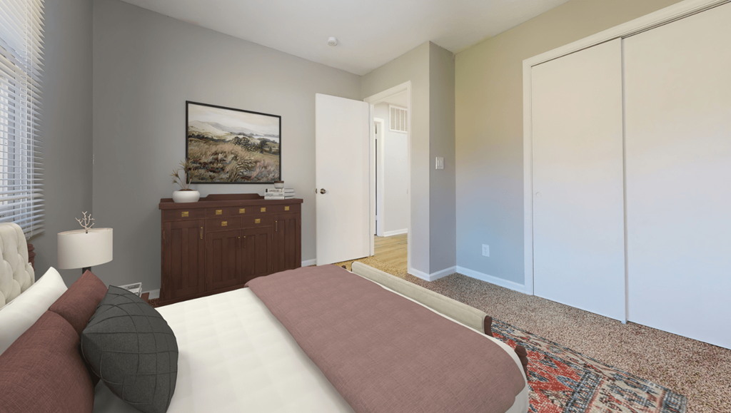 a bedroom with a bed and a dresser and a door to a hallway at Stonebrook of Franklin, Franklin, 46131