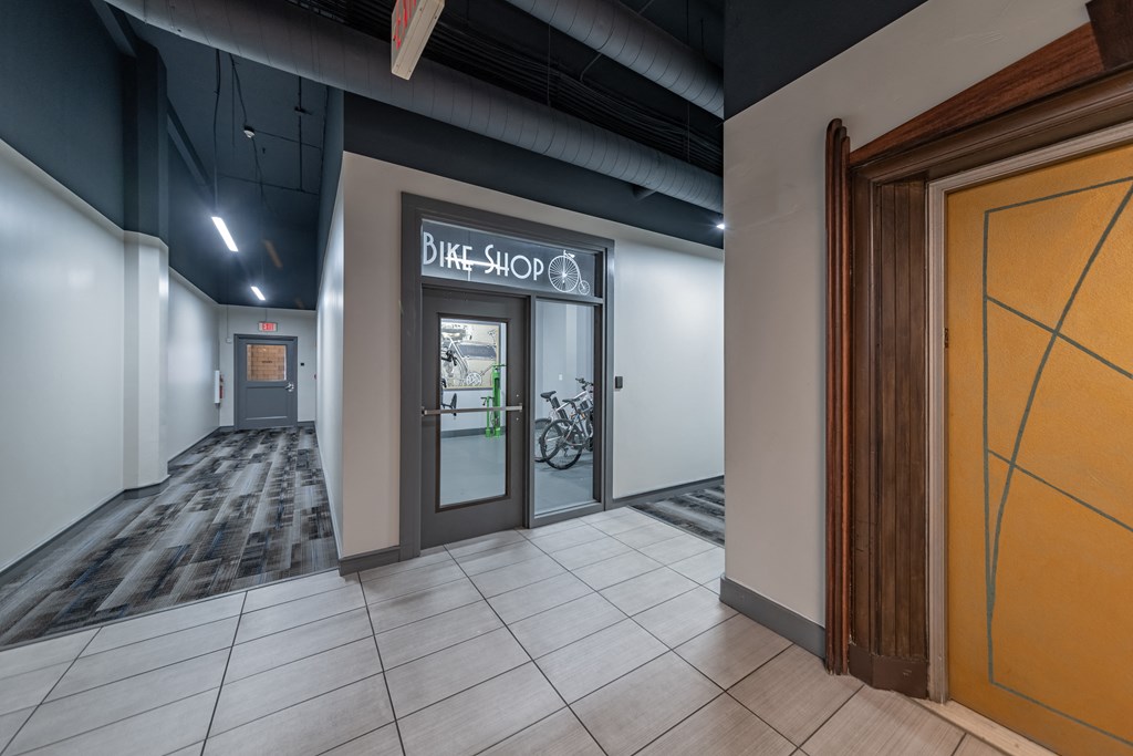 a door to a bike shop in a building