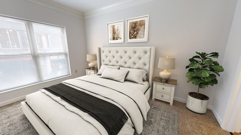 a bedroom with a bed and two windows