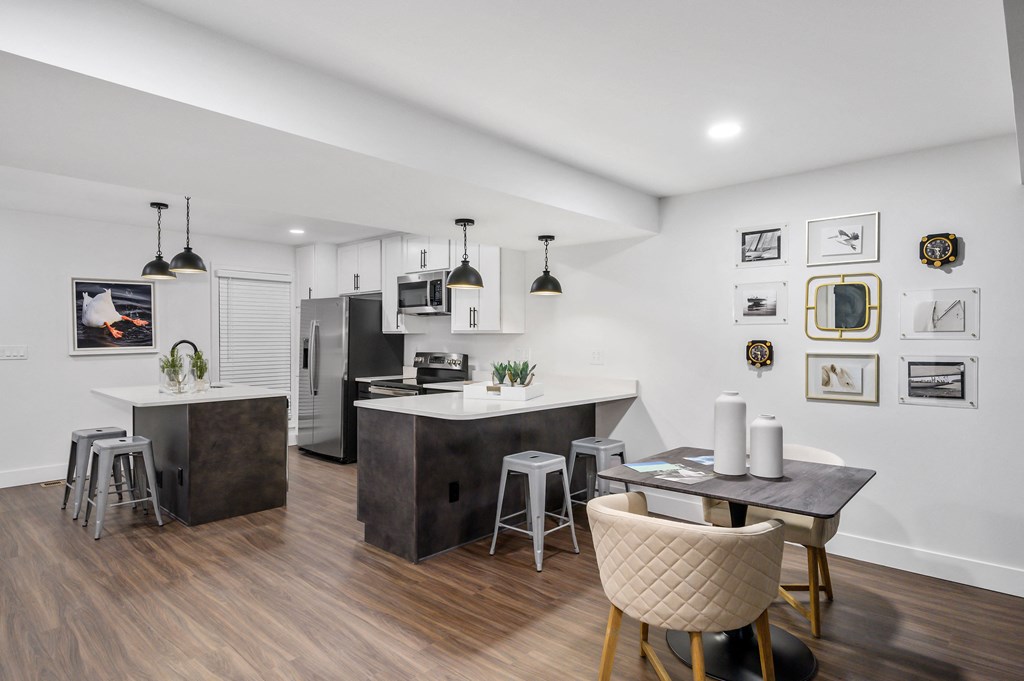 a kitchen and dining area in a 555 waverly unit