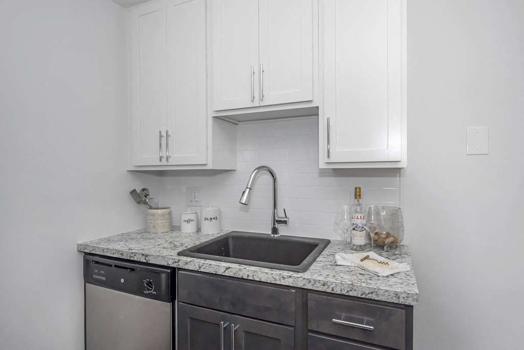 Kitchen with white cabinets and a sink and a counter top at Tall Timber Apartments, Cincinnati, OH, 45241