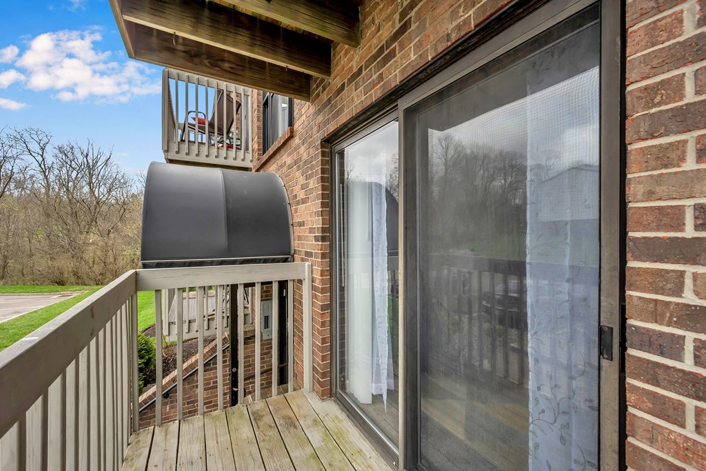 Deck has a large sliding glass door to the patio at Tall Timber Apartments, Cincinnati, OH