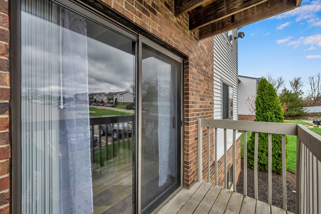 Deck of a home with a sliding glass door at Tall Timber Apartments, Cincinnati, OH, 45241