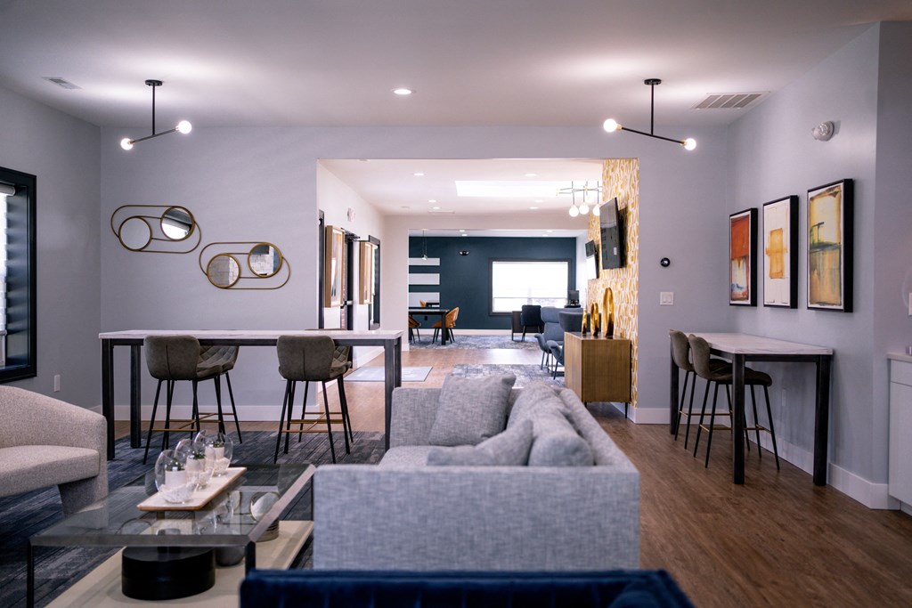 a living room and dining room with a couch and a table