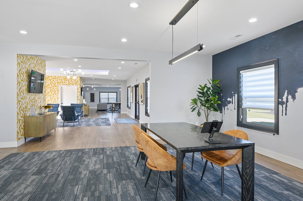 a dining room with a table and chairs and a living room