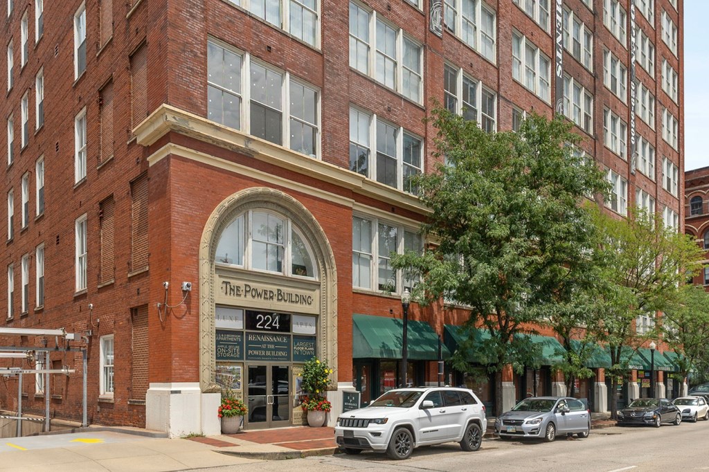 A street view of a building with the sign "The Power Building 224".