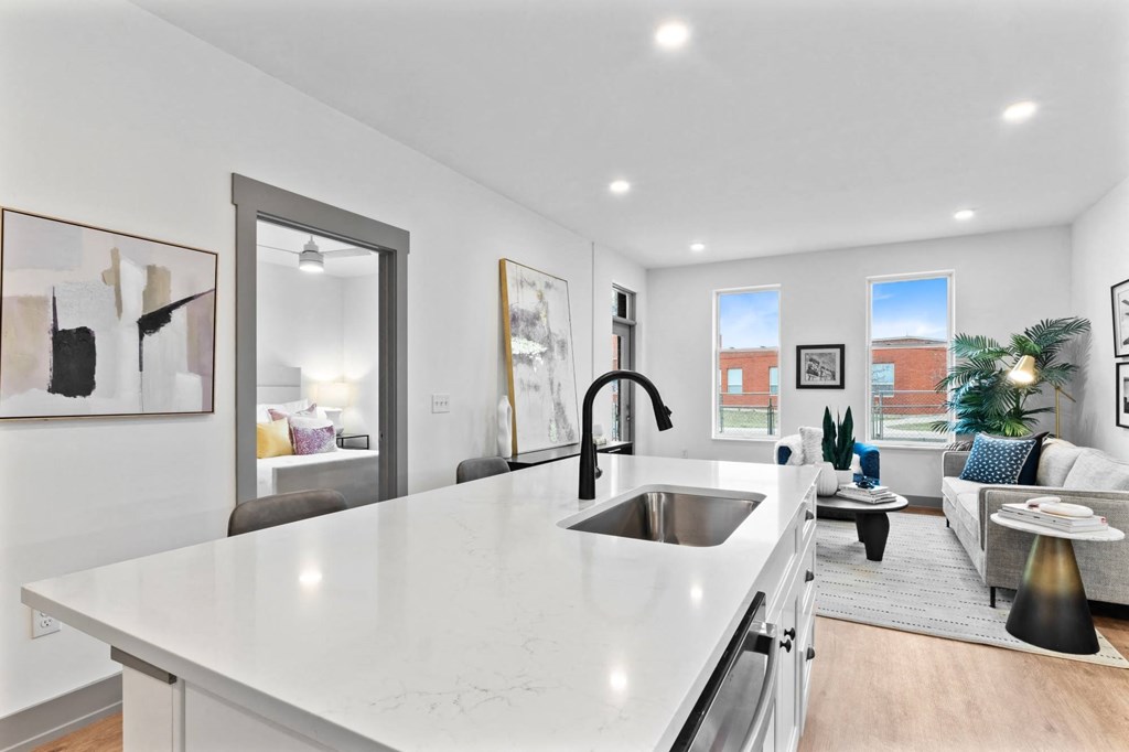A modern kitchen with a white countertop and stainless steel appliances. at The Ridge Apartments, Cincinnati, Ohio